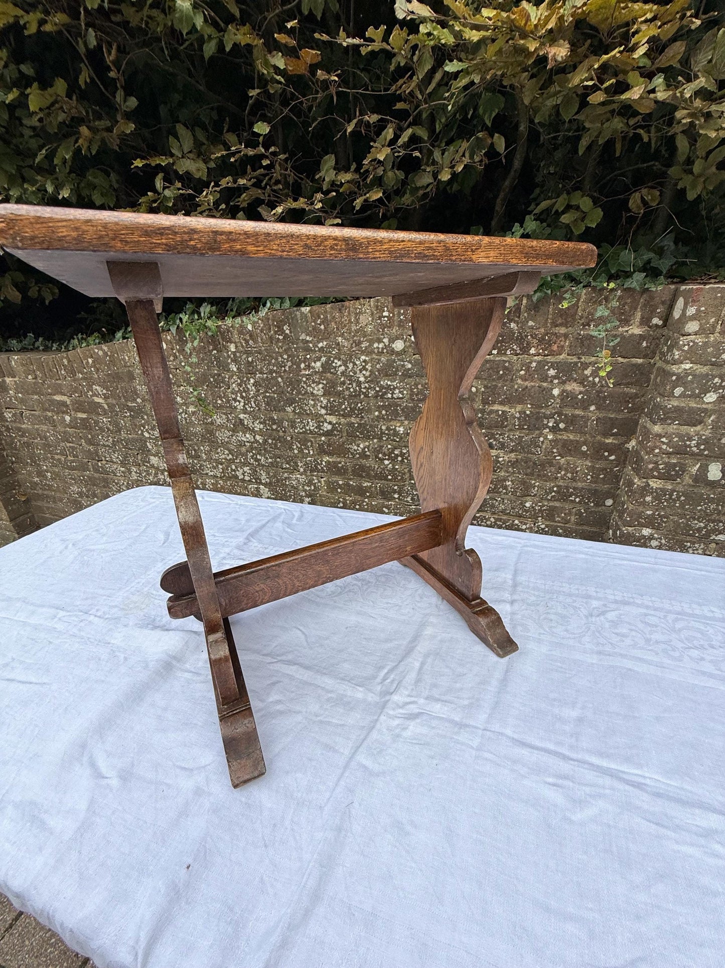 Antique Arts & Crafts Oak Side Table, Early 20th Century English Rustic Occasional Table with Carved Trestle Base