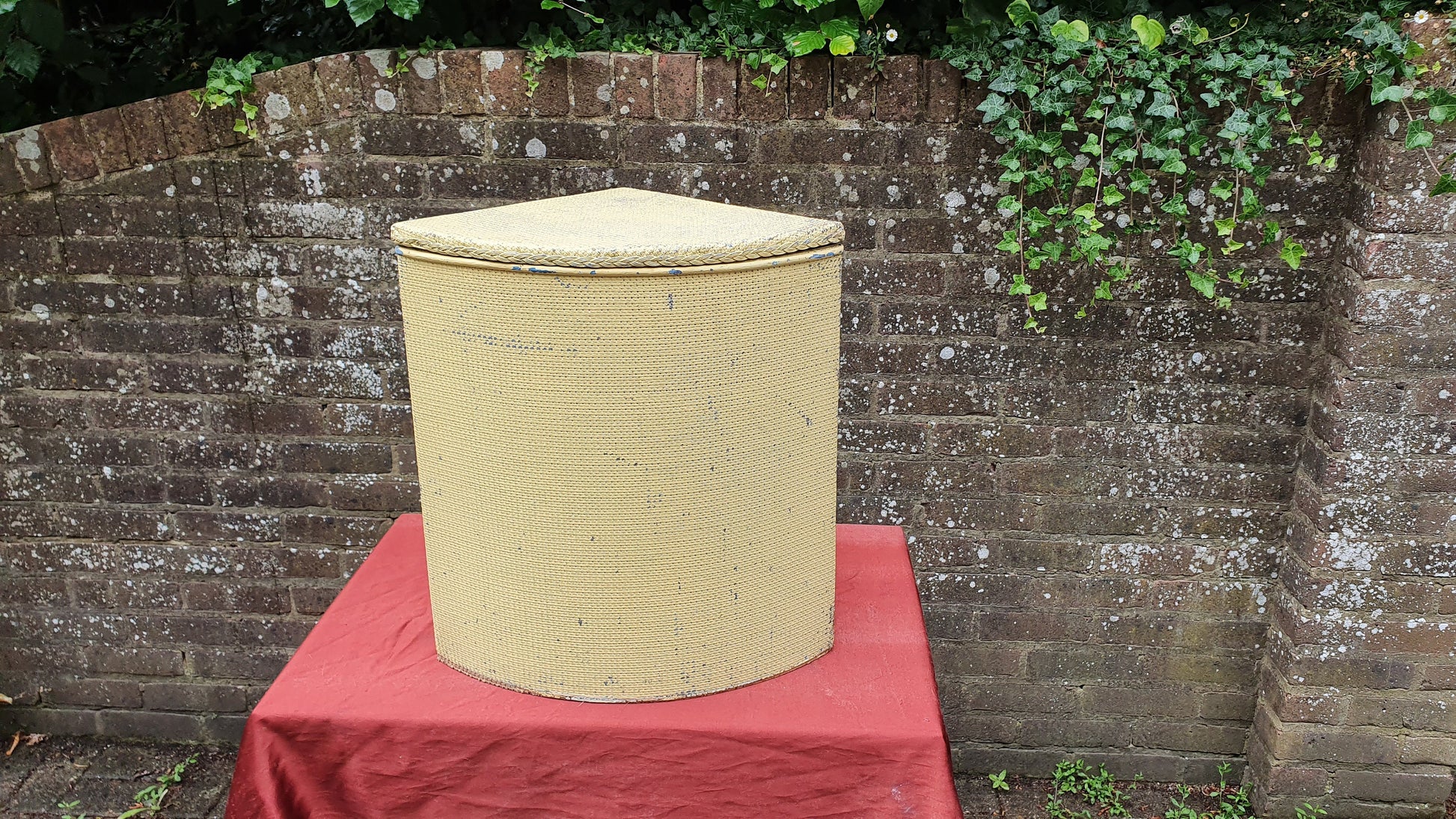 Painted Lloyd Loom Style Yellow Painted Corner Linen Basket.
