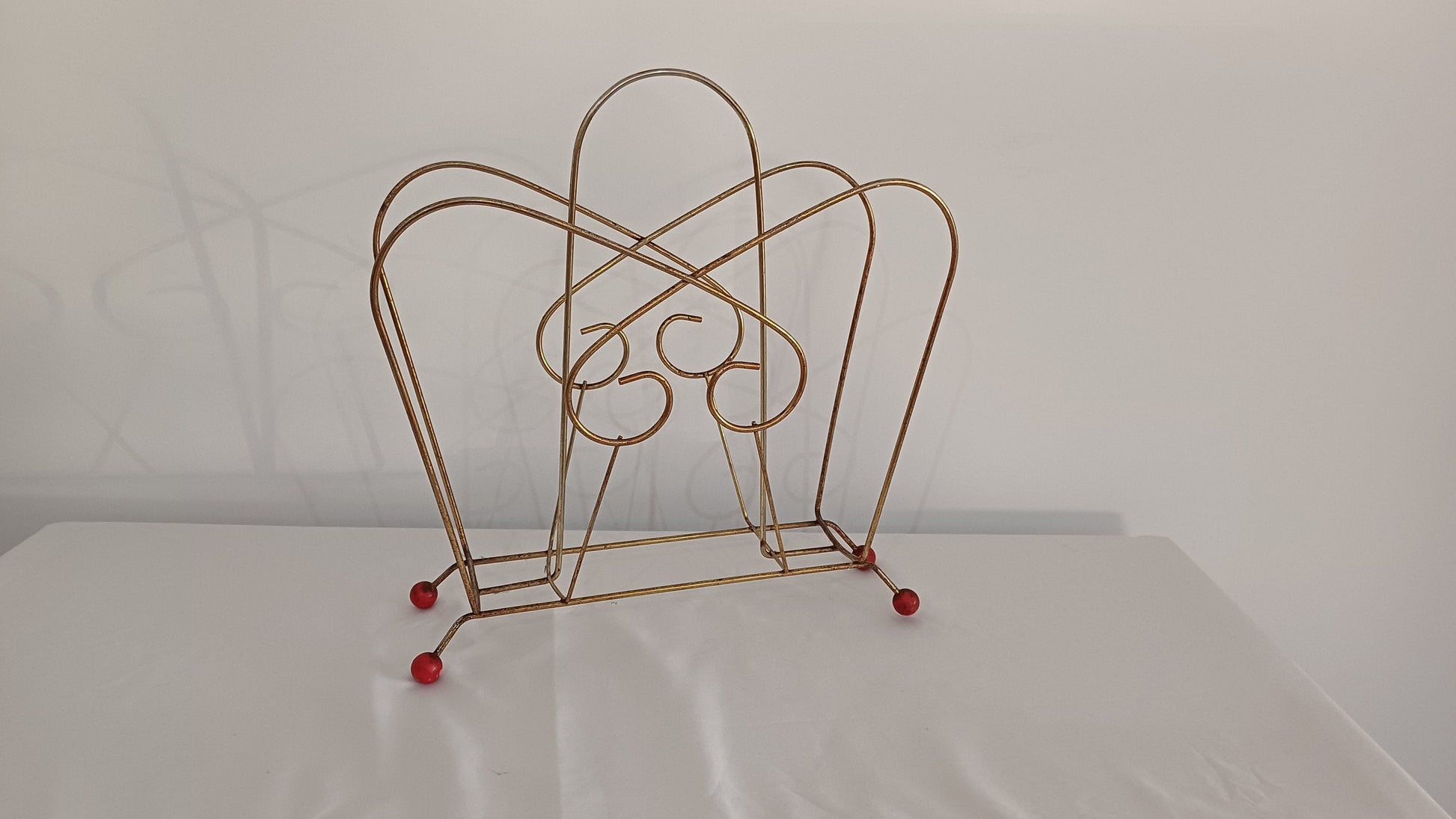 Cute Retro 1950s Gold Metal Magazine Rack With Atomic Feet.