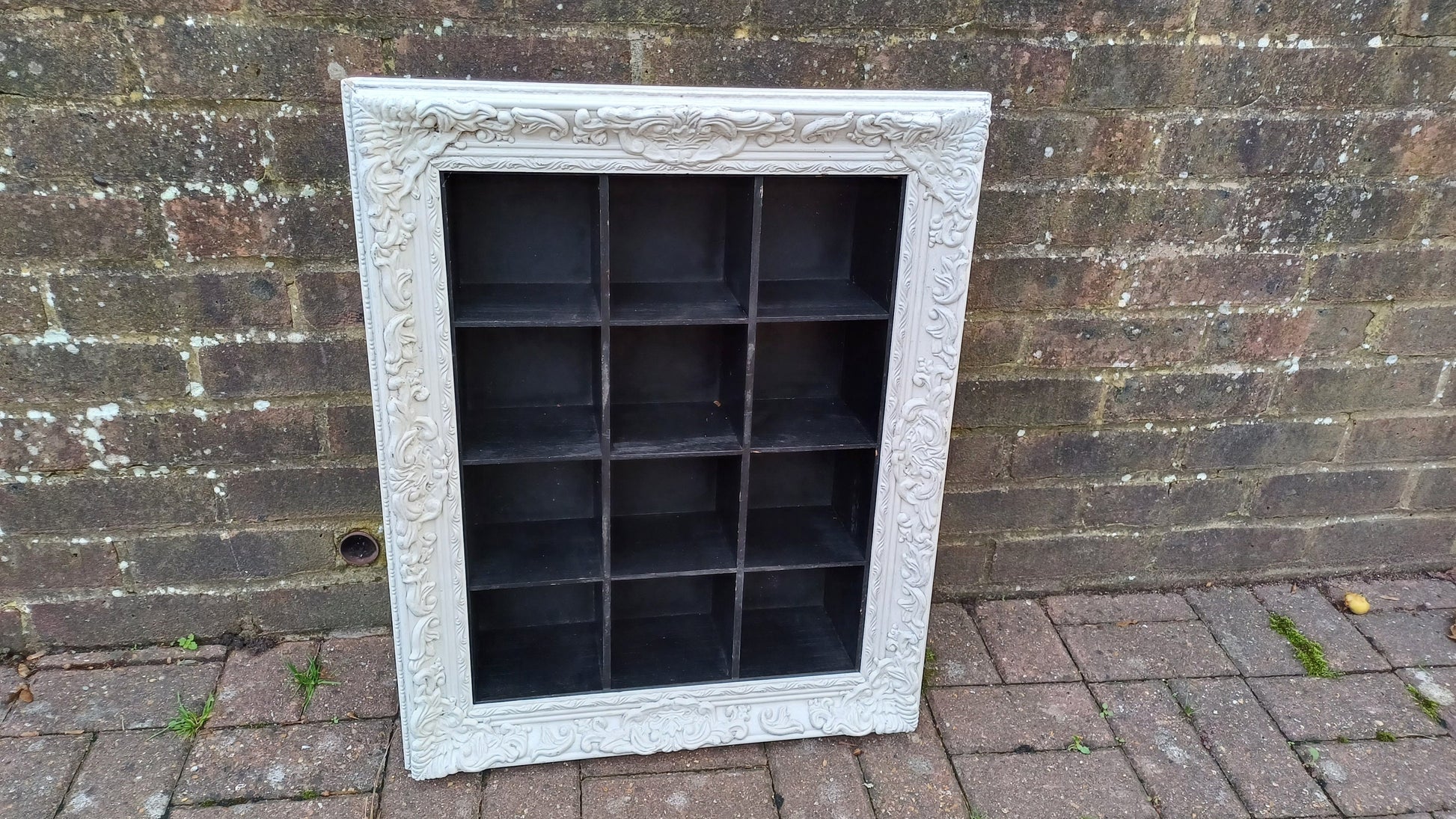 Vintage Style Wooden Black and White Cubby Hole Shelves Within Orante White Frame.