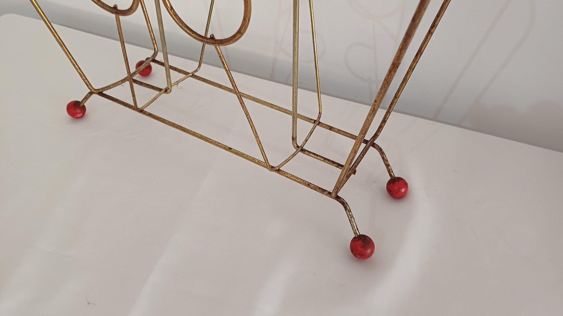 Cute Retro 1950s Gold Metal Magazine Rack With Atomic Feet.