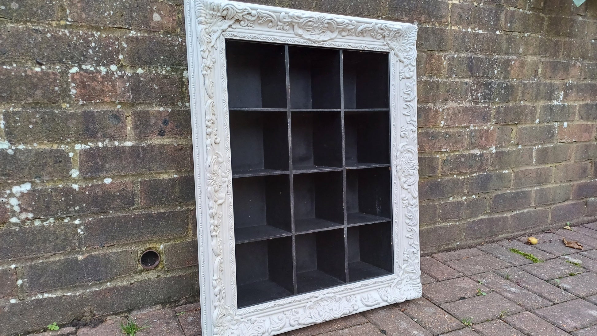 Vintage Style Wooden Black and White Cubby Hole Shelves Within Orante White Frame.