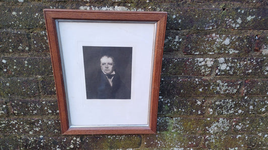 black and white photo of man in a wooden frame