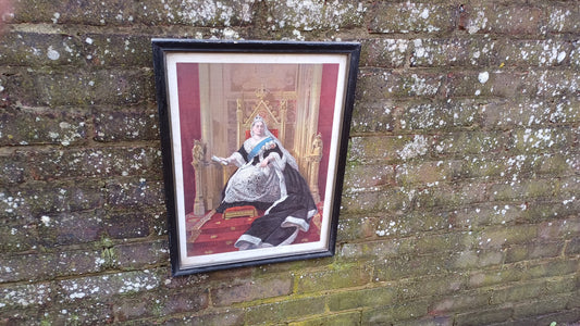 vintage printof QueenVictoria in a black wooden frame
