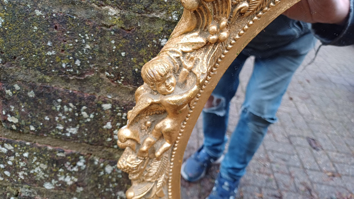 Vintage Composite Cherub Gold Gilt Decorative Mirror.