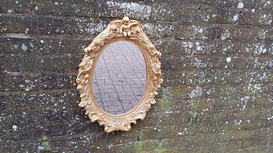 Vintage Composite Cherub Gold Gilt Decorative Mirror.