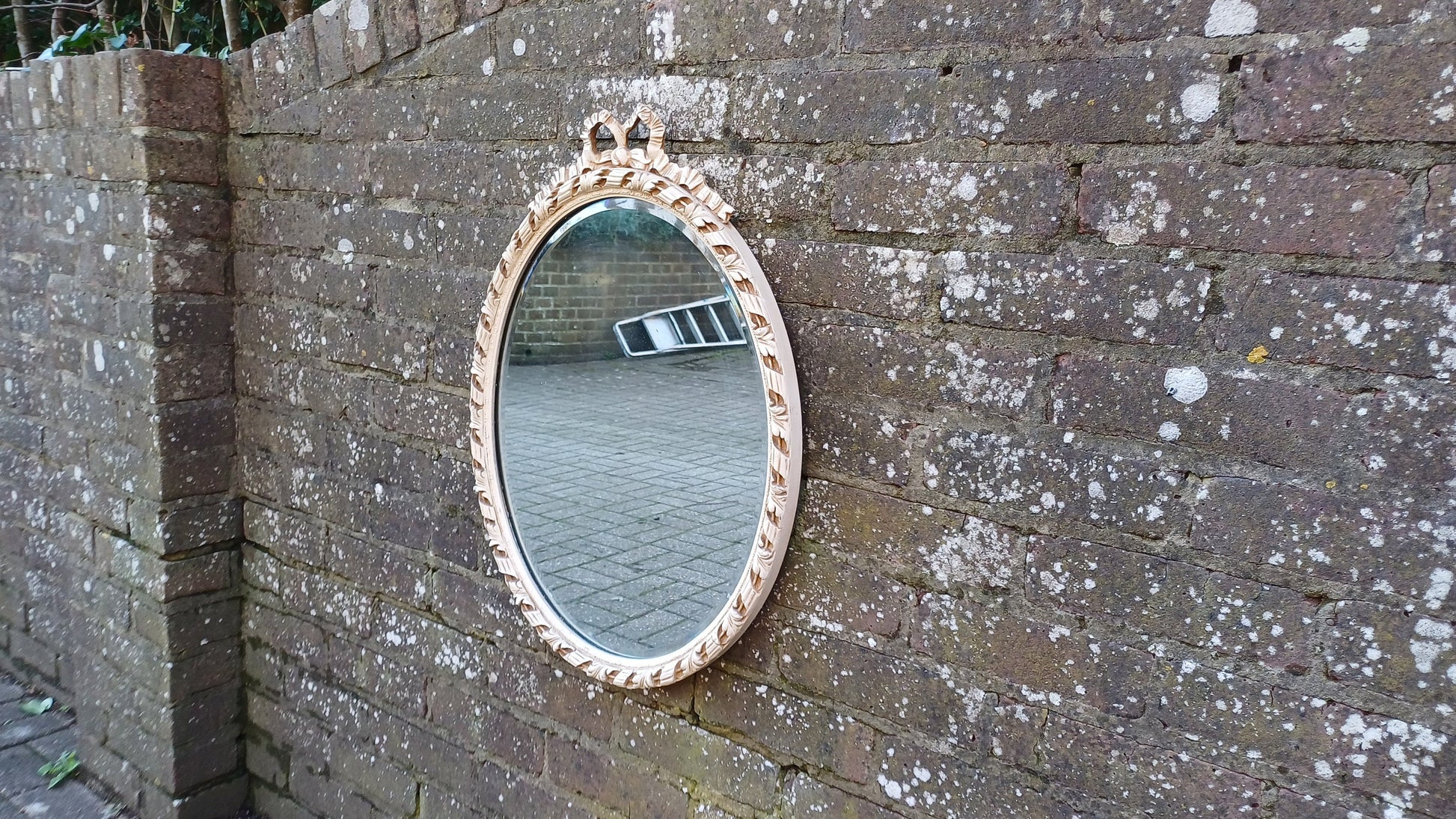 Large Vintage Oval 50s or 60s Painted Cream and God Oval Wall Mirror. Ribbon Decoration.
