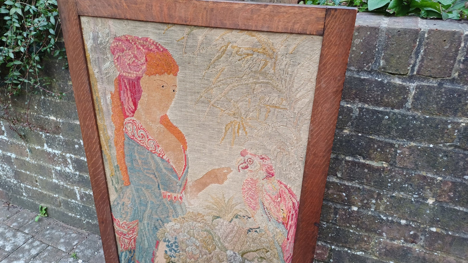 Large Vintage Solid Oak Arts and Crafts Fire Screen Tapestry Lady Feeding Parrot. One Metre Tall