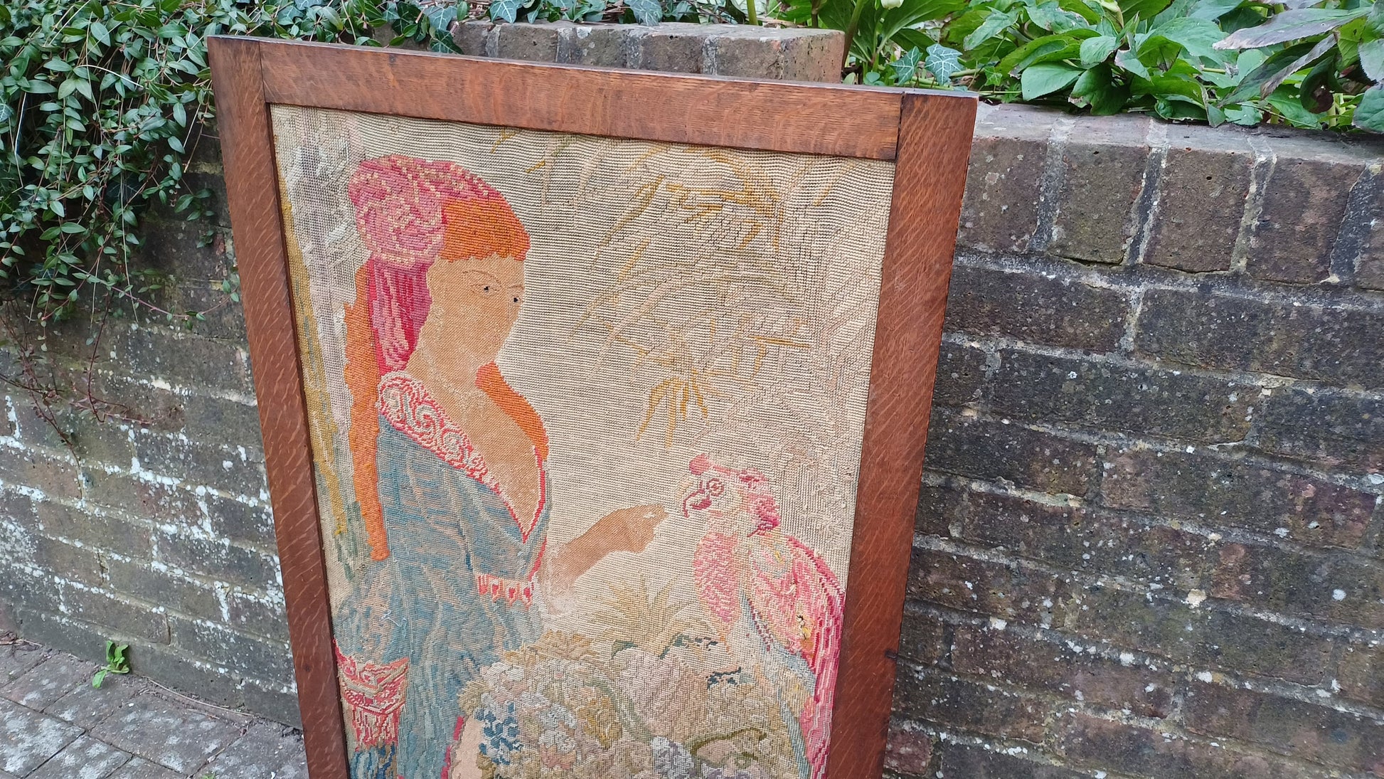 Large Vintage Solid Oak Arts and Crafts Fire Screen Tapestry Lady Feeding Parrot. One Metre Tall