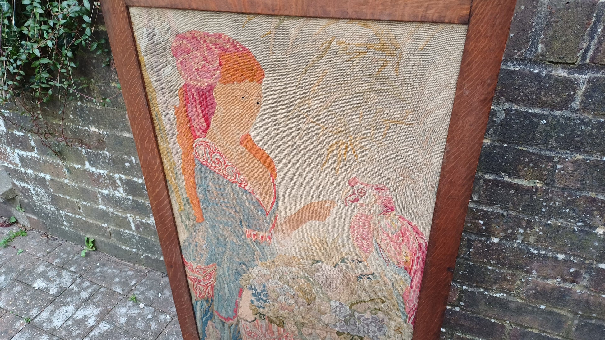 Large Vintage Solid Oak Arts and Crafts Fire Screen Tapestry Lady Feeding Parrot. One Metre Tall