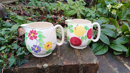 pottery jugs; floral jug, apples jug, kitchen jugs