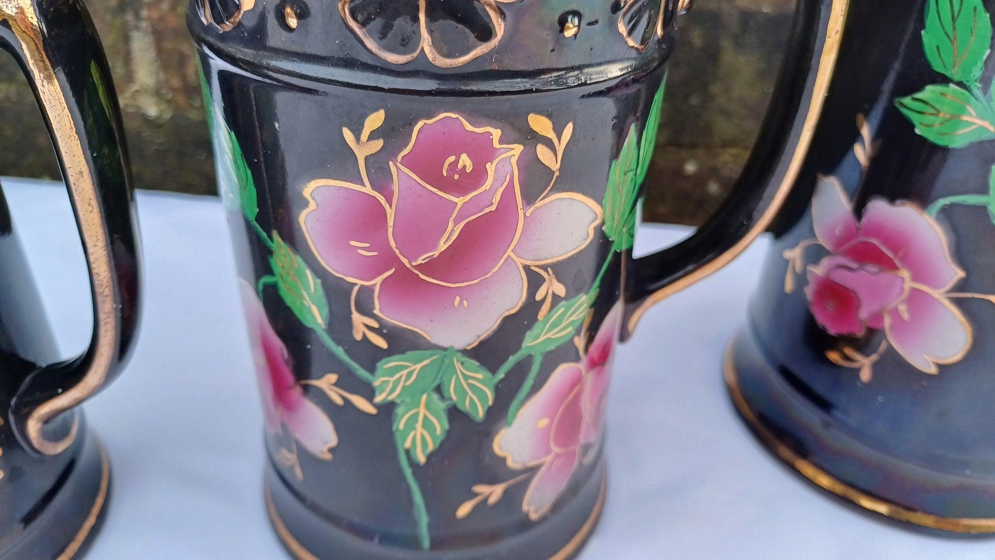 Rare Set of Vintage Victorian Graduated Jugs Black with Pink Flowers Gold Decoration.