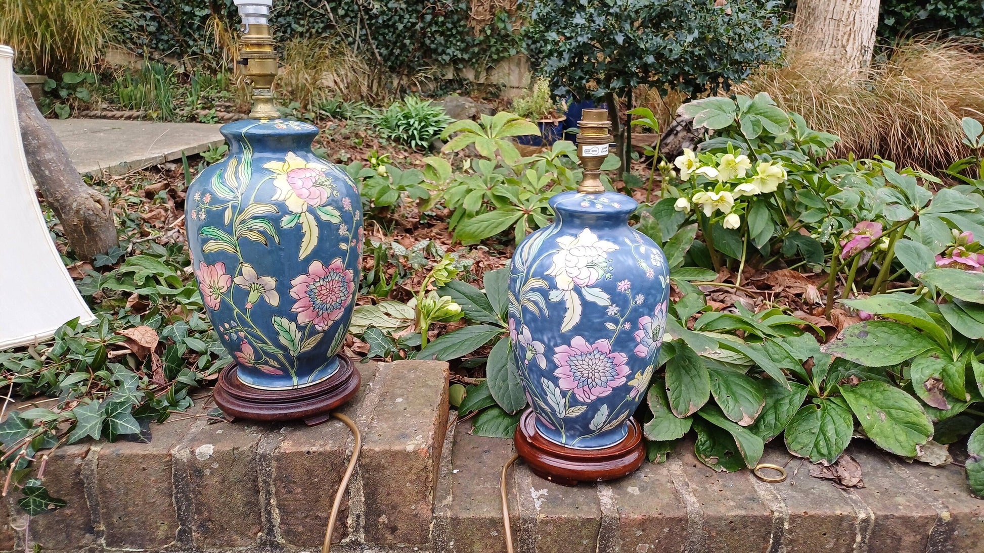 BLUE CERAMIC lampswith flowers on them