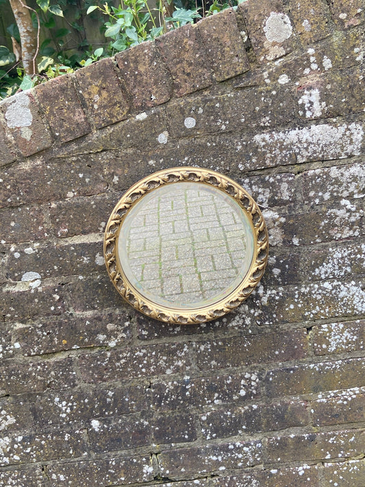 round vintage gold mirror
