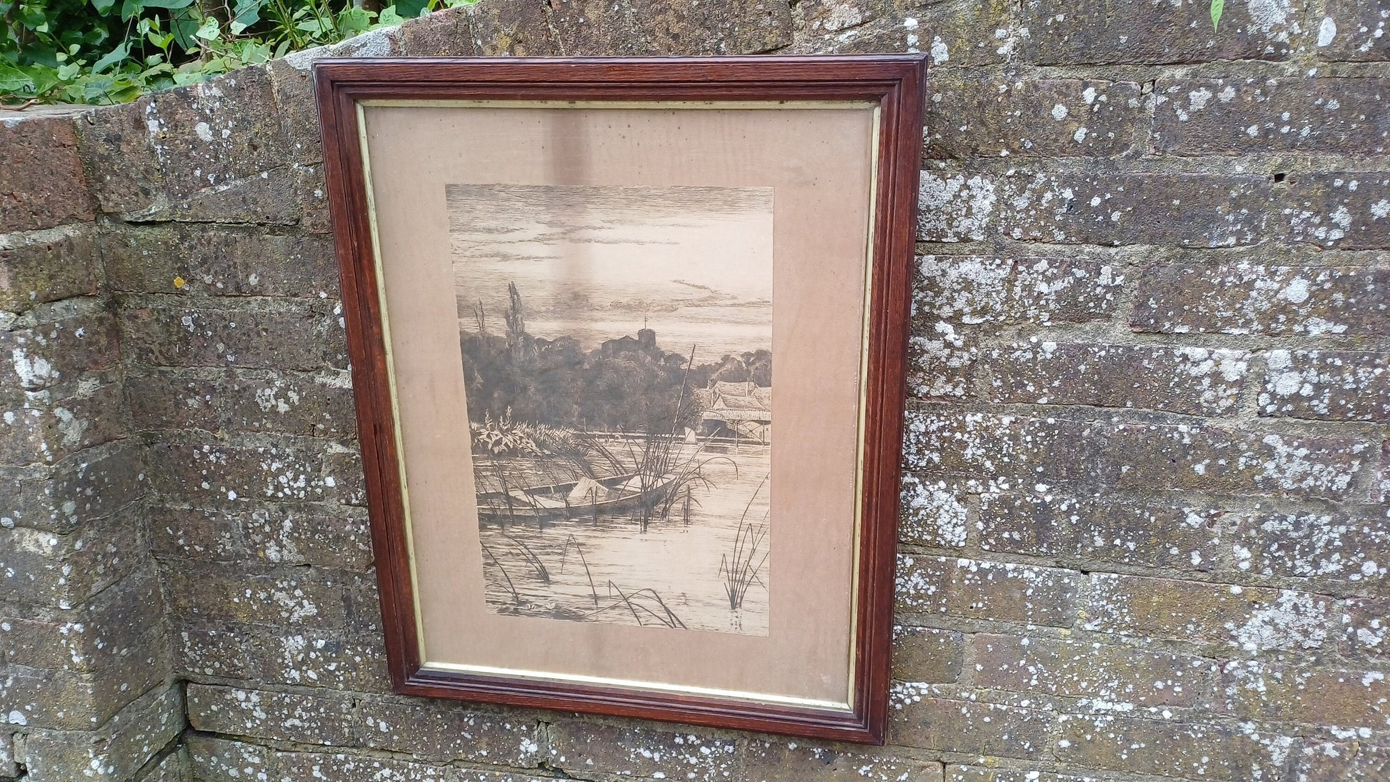 Glazed antique wooden frame with vintage ink drawing ofpond, boat, houses