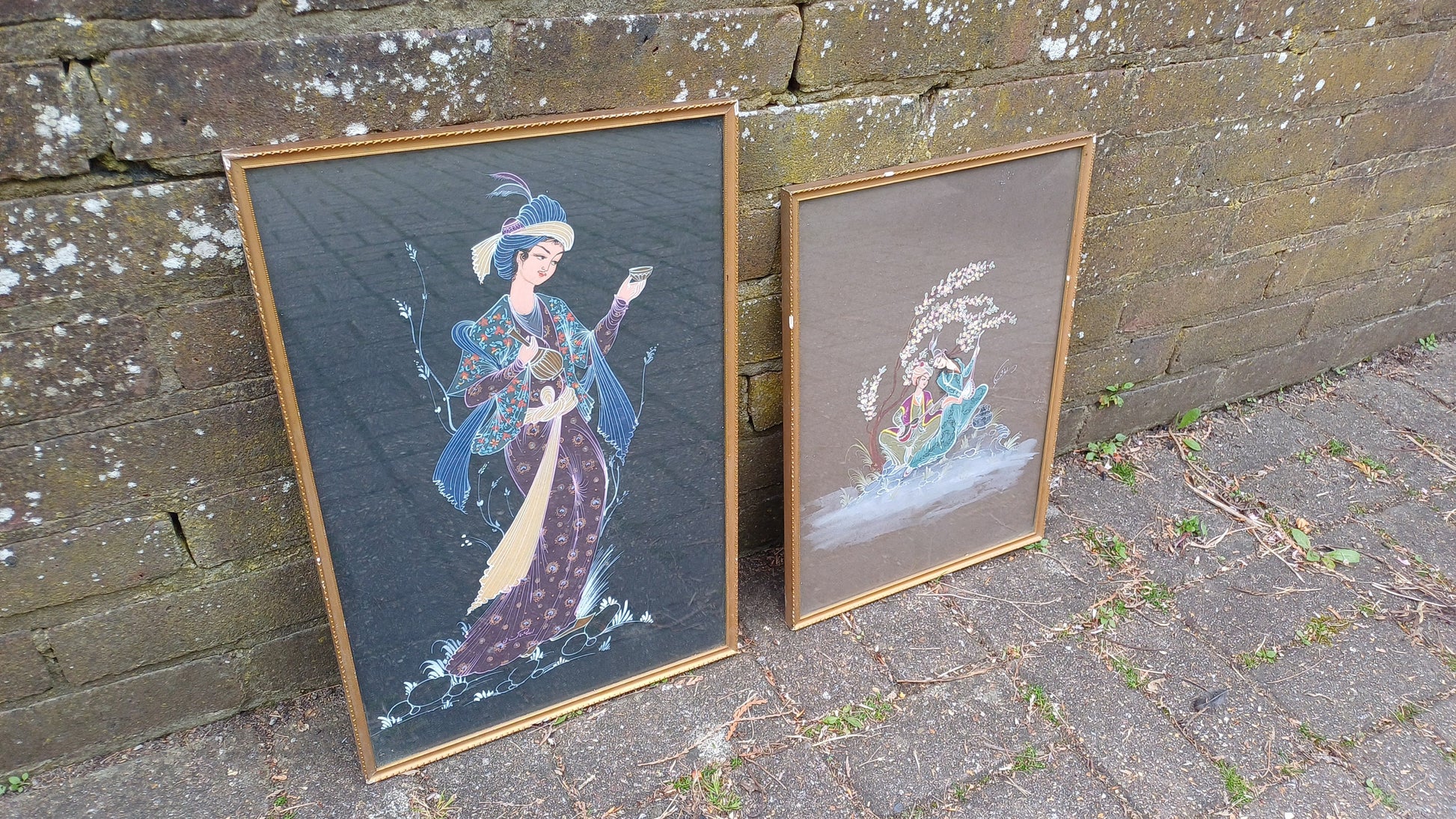 Two interesting Arabian prince princess paintings - colourful on black brown background, vintage gold glazed frames; Arabic Arabian Nights