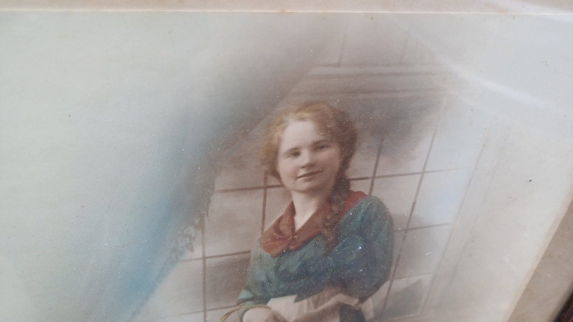Vintage photo sepia of young woman, in dark wood vintage glazed frame
