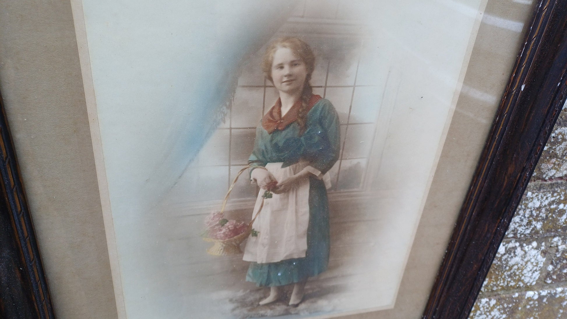 Vintage photo sepia of young woman, in dark wood vintage glazed frame