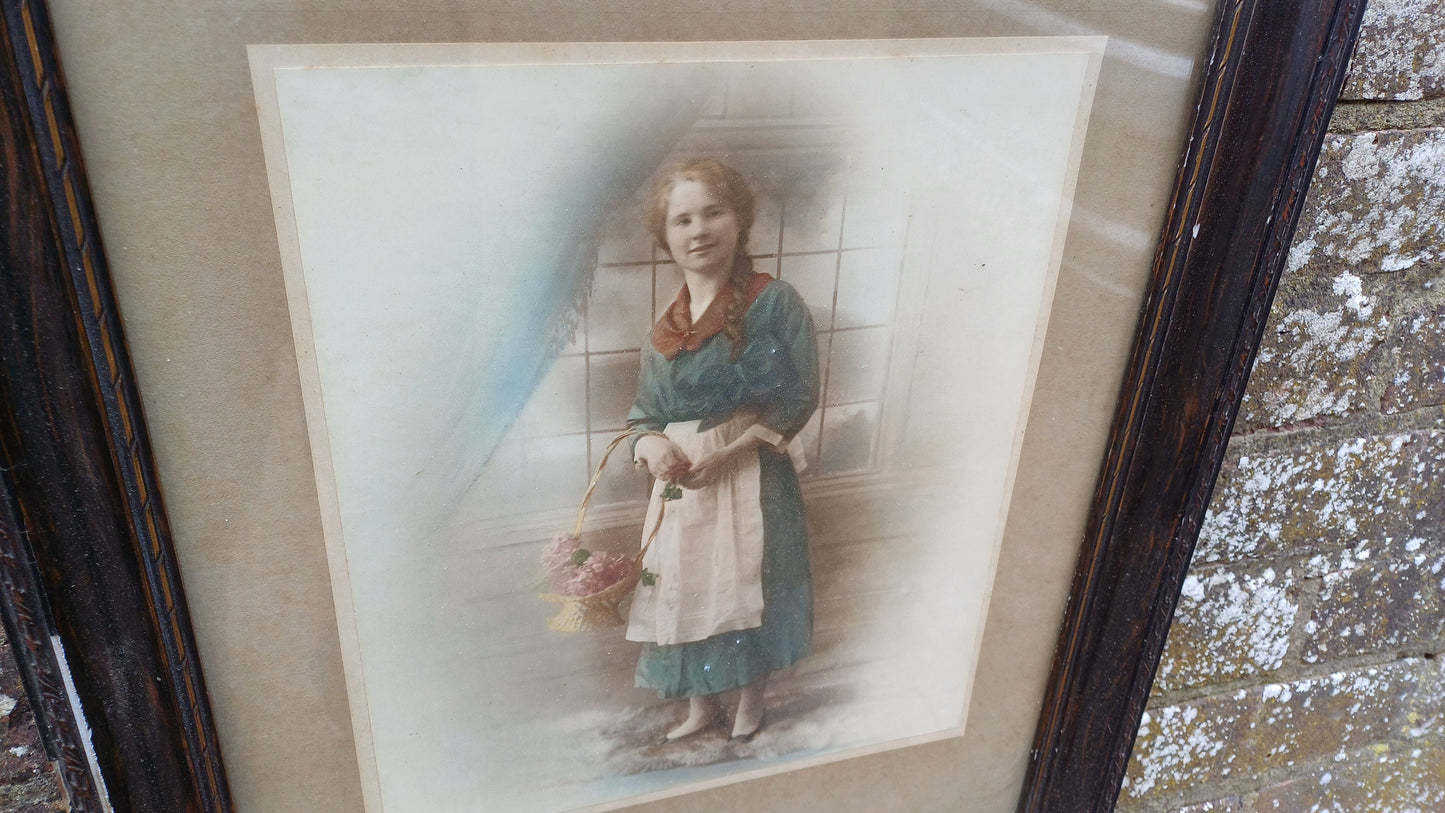 Vintage photo sepia of young woman, in dark wood vintage glazed frame