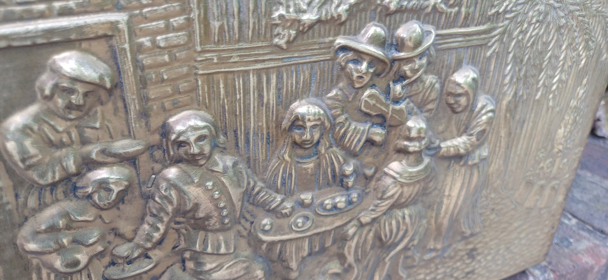 Vintage Brass Magazine Rack Gathering Outside an Inn