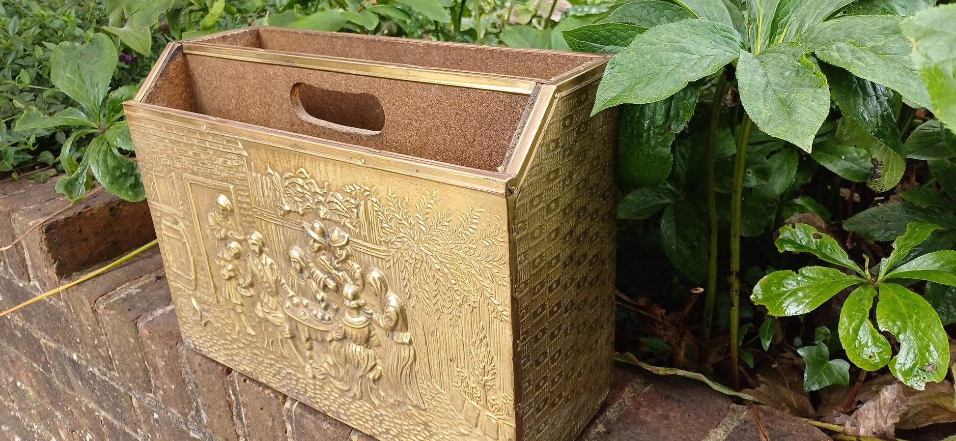 Vintage Brass Magazine Rack Gathering Outside an Inn