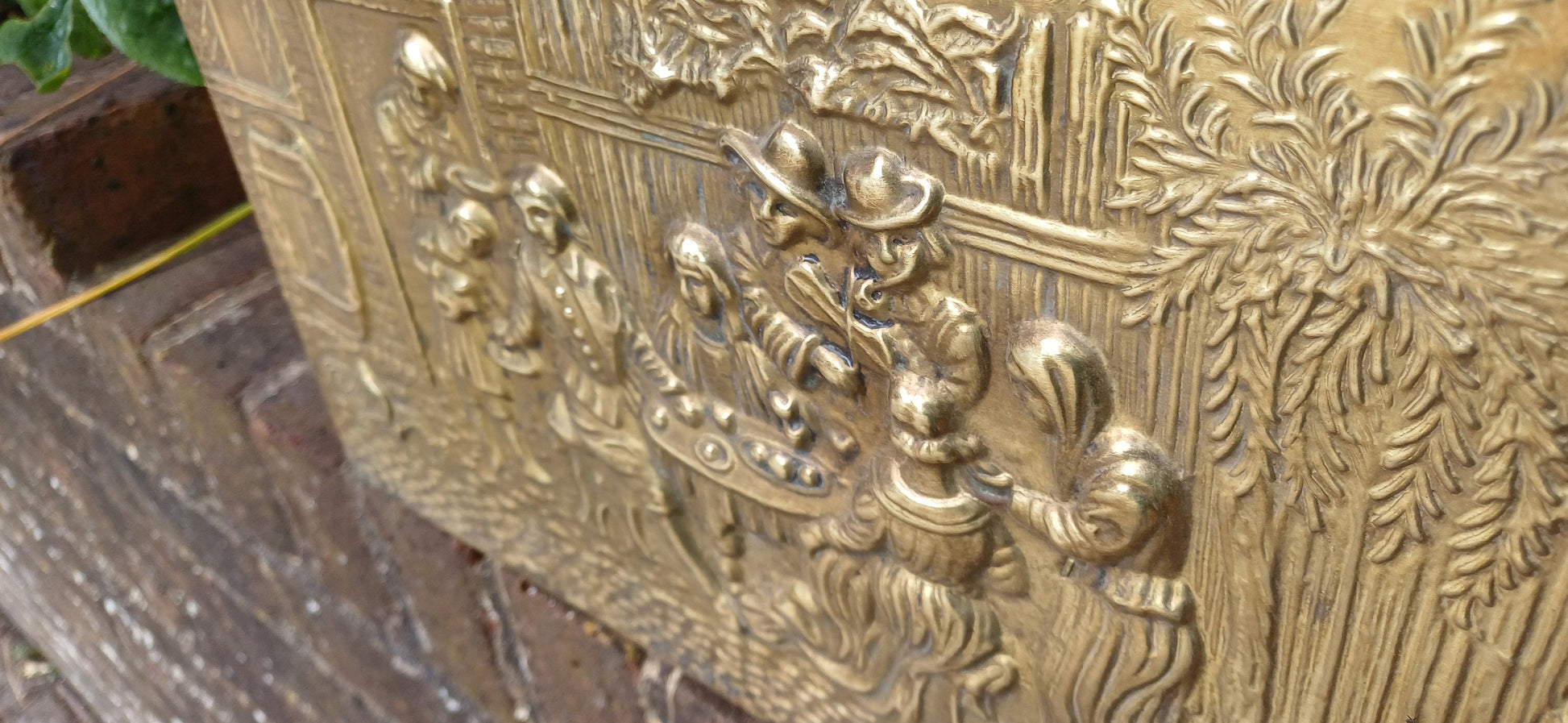 Vintage Brass Magazine Rack Gathering Outside an Inn