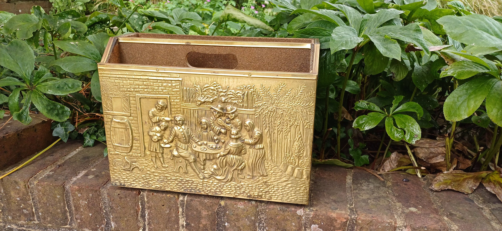 Vintage Brass Magazine Rack Gathering Outside an Inn