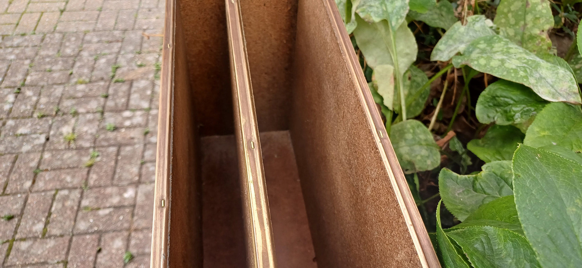 Vintage Brass Magazine Rack Gathering Outside an Inn