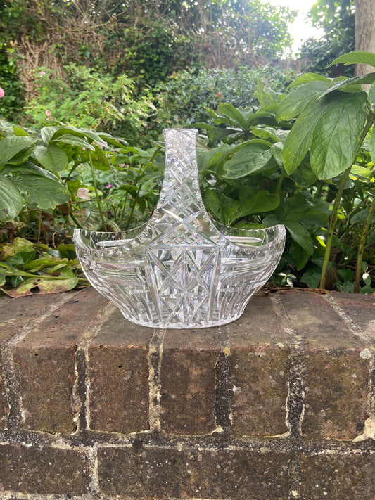 crystal glassbowl. shaped like a basket. great for displaying fruit, flowers, pebbles etc. excellent quality with the glass catching the light. excellent condition