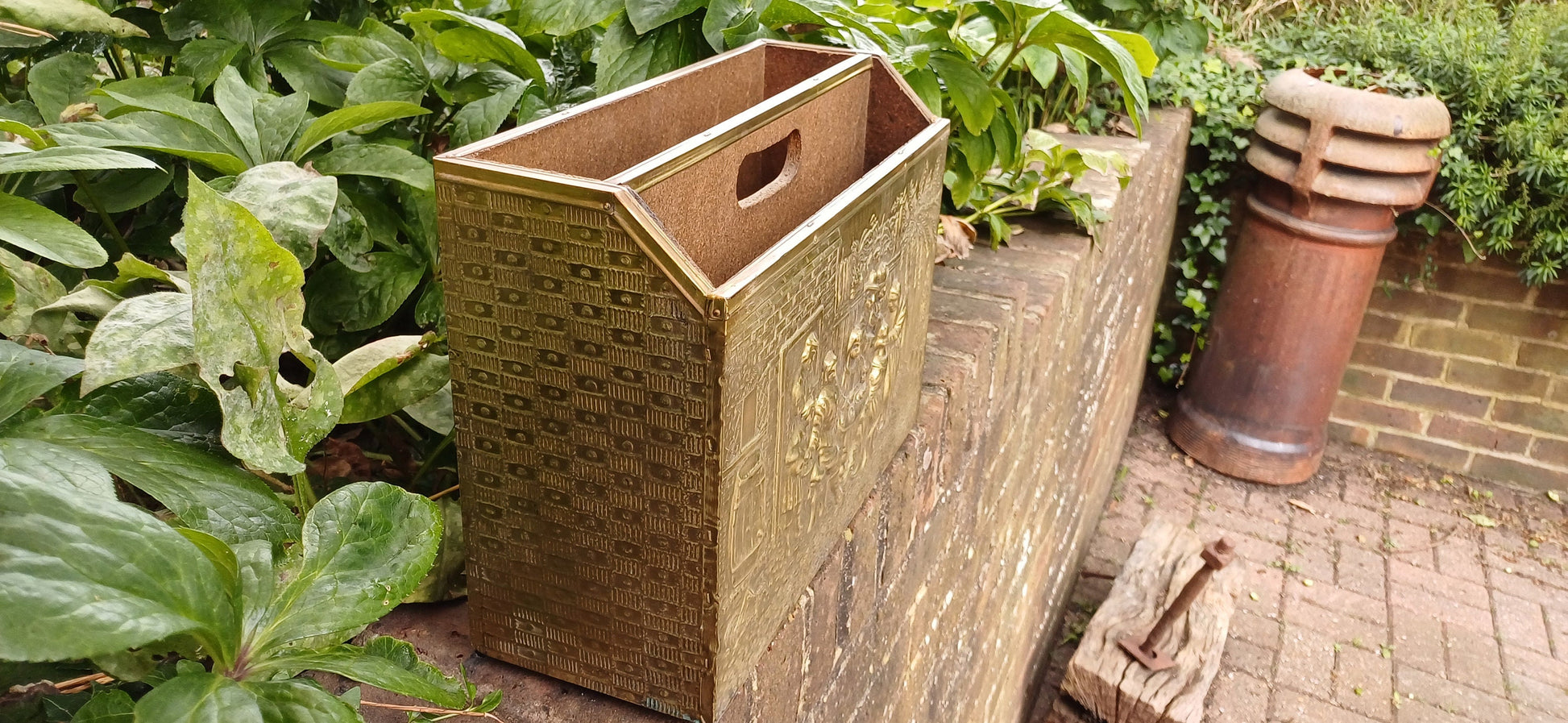 Vintage Brass Magazine Rack Gathering Outside an Inn