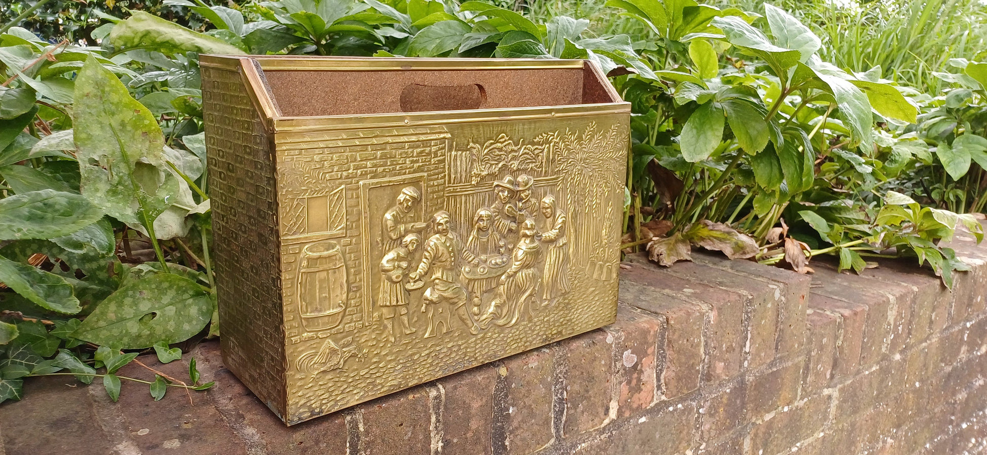 Vintage Brass Magazine Rack Gathering Outside an Inn