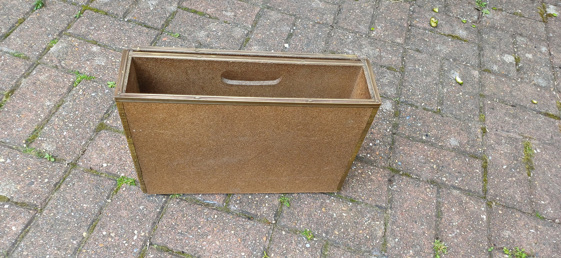 Vintage Brass Magazine Rack Gathering Outside an Inn