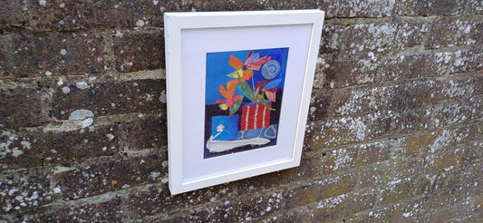 very colourful mixed media needlework picture of flowers in vases. in a white frame with glass.