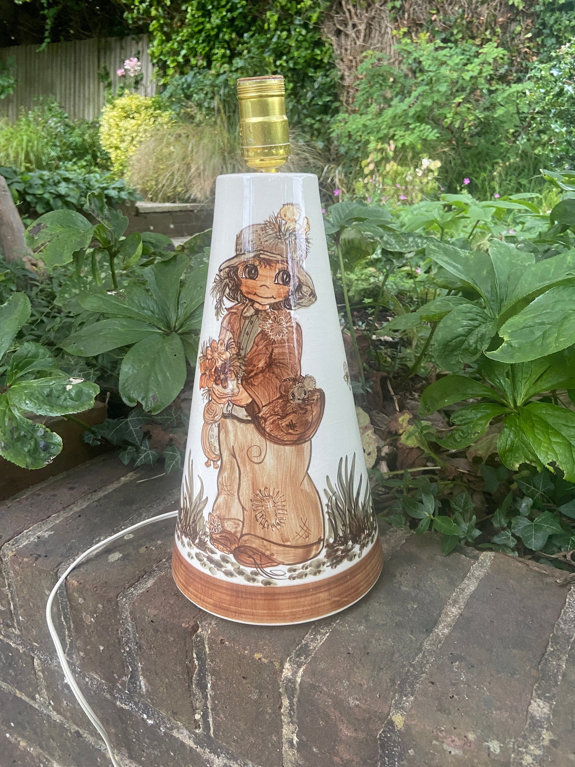 jersey pottery wide eyed boy hand painted on a retro lamp. large working table lamp. browns and beiges