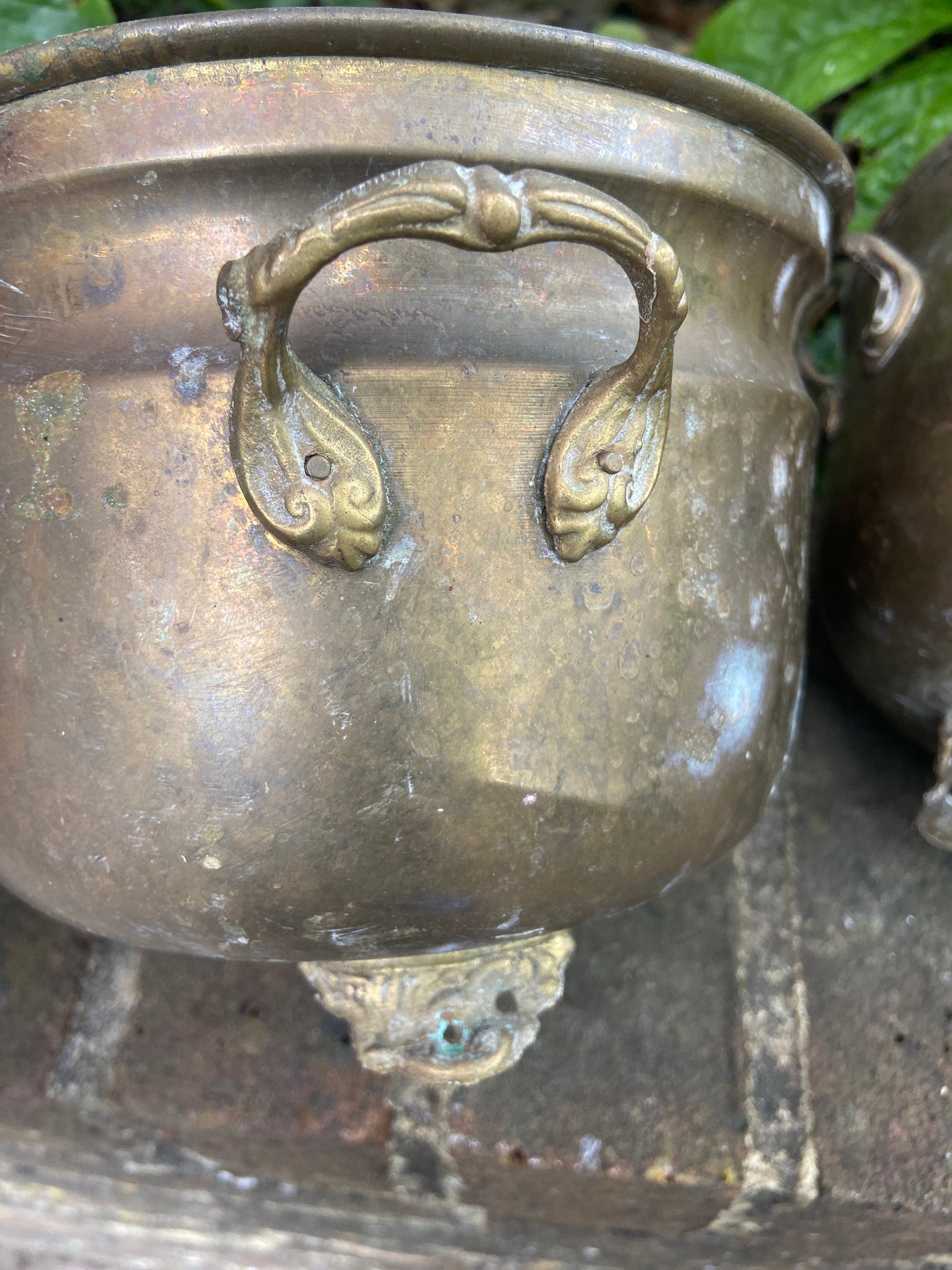 three brass planters, two simialr