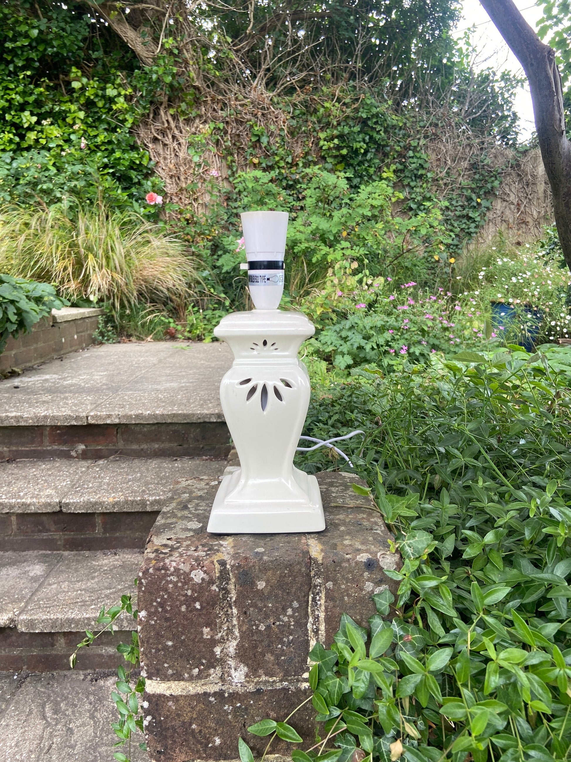 a lantern style vintage table lamp. ceramic with a glaze. not very old so wiring all up to date. attractive style. very good condition.