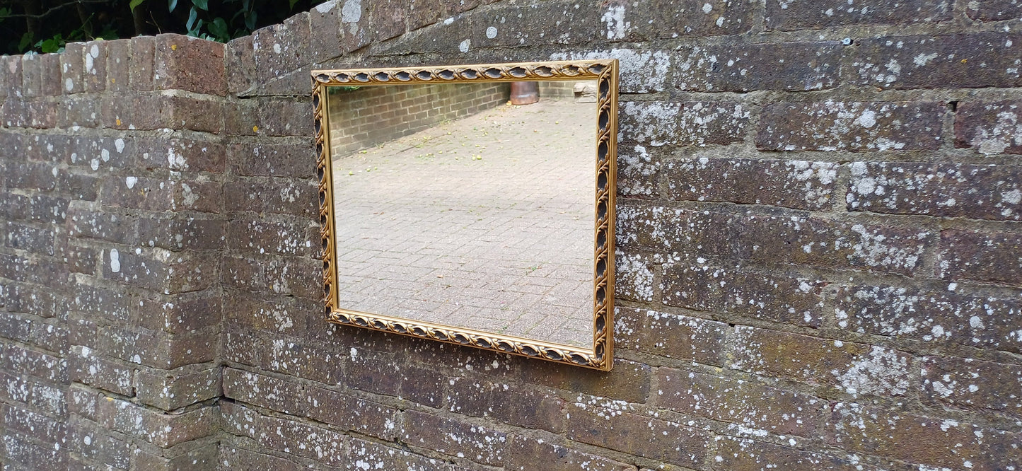 Large Vintage 60s Gold and Black Ornate Wall Mirror.