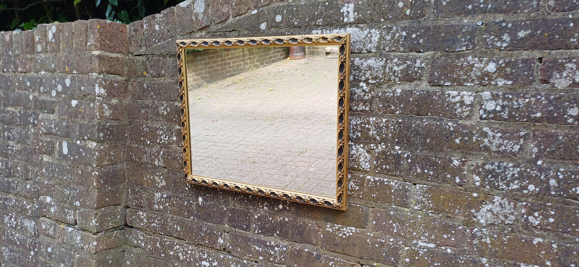 Large Vintage 60s Gold and Black Ornate Wall Mirror.