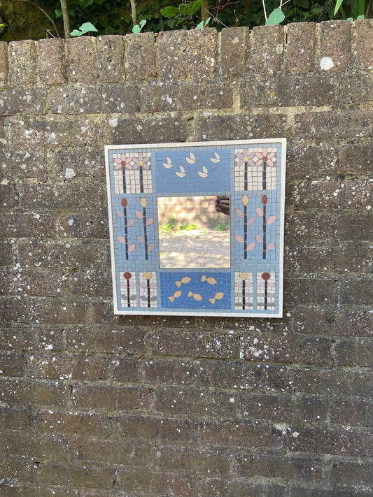 hand made mosaic mirror. likely 1990s. pretty blue colours. flower andanimal detail. art deco look and feel to it. in excellent condition