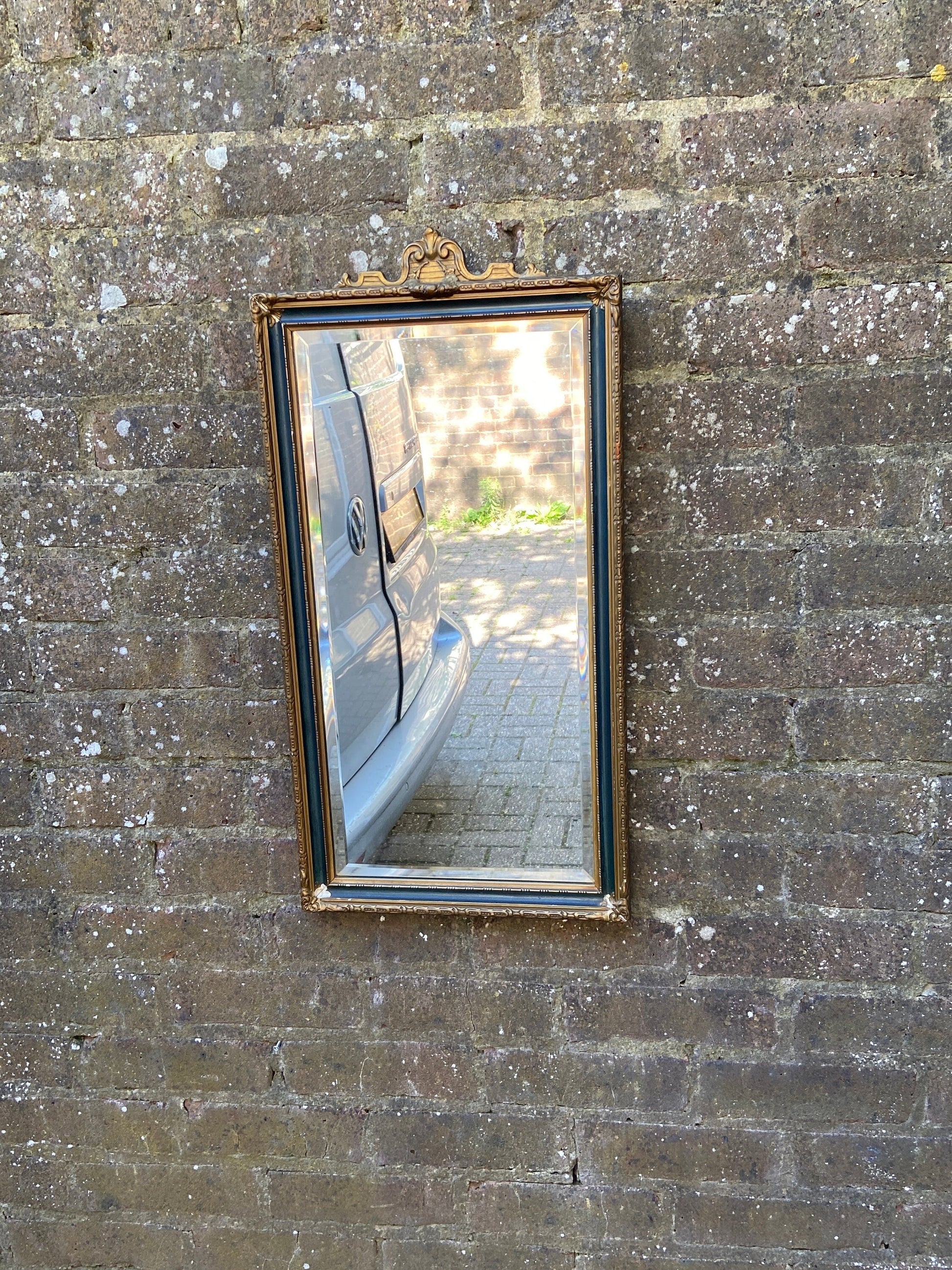 early 1900s vintage wall mirror. gorgeous gilt and green detailed frame. excellent quality bevelled glass. original backing and chain. Superb mirror with loads of charm.