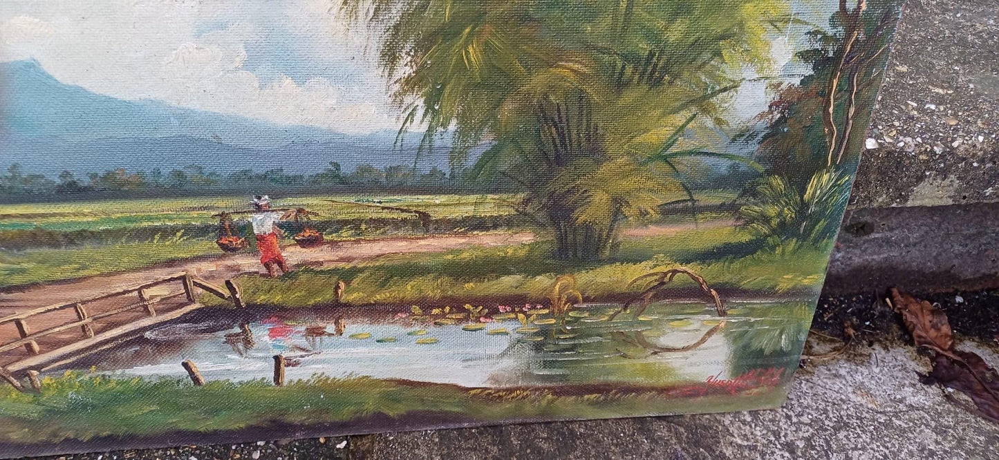1960s oil on board by artist Yusoff Abdullah. Rural scene of a villager / farmer carrying goods across a field. Signed painting