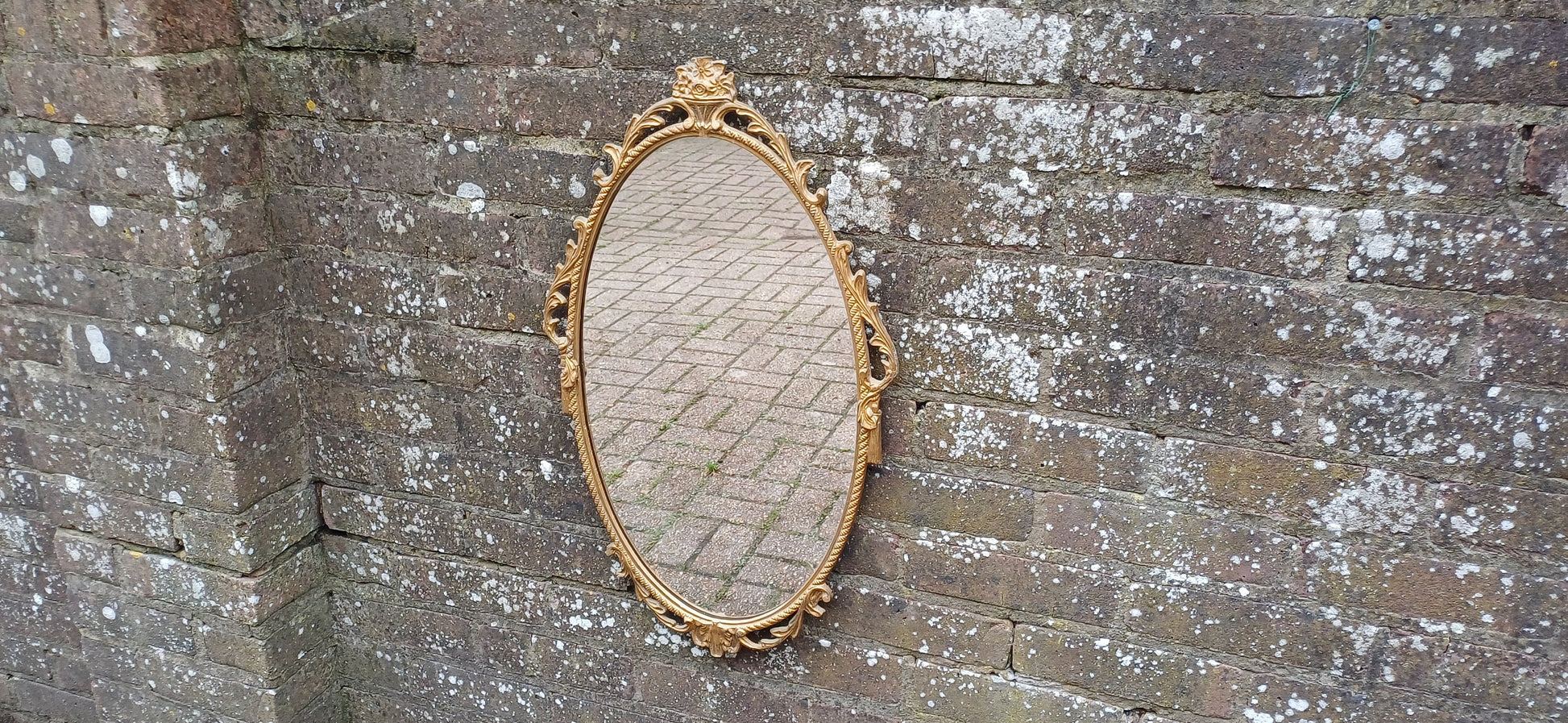 Beautiful Vintage 80s or 90s Ornate Oval Metal Gold Italian Style Wall Mirror Flower in Basket Decoration