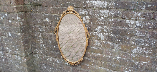Beautiful Vintage 80s or 90s Ornate Oval Metal Gold Italian Style Wall Mirror Flower in Basket Decoration