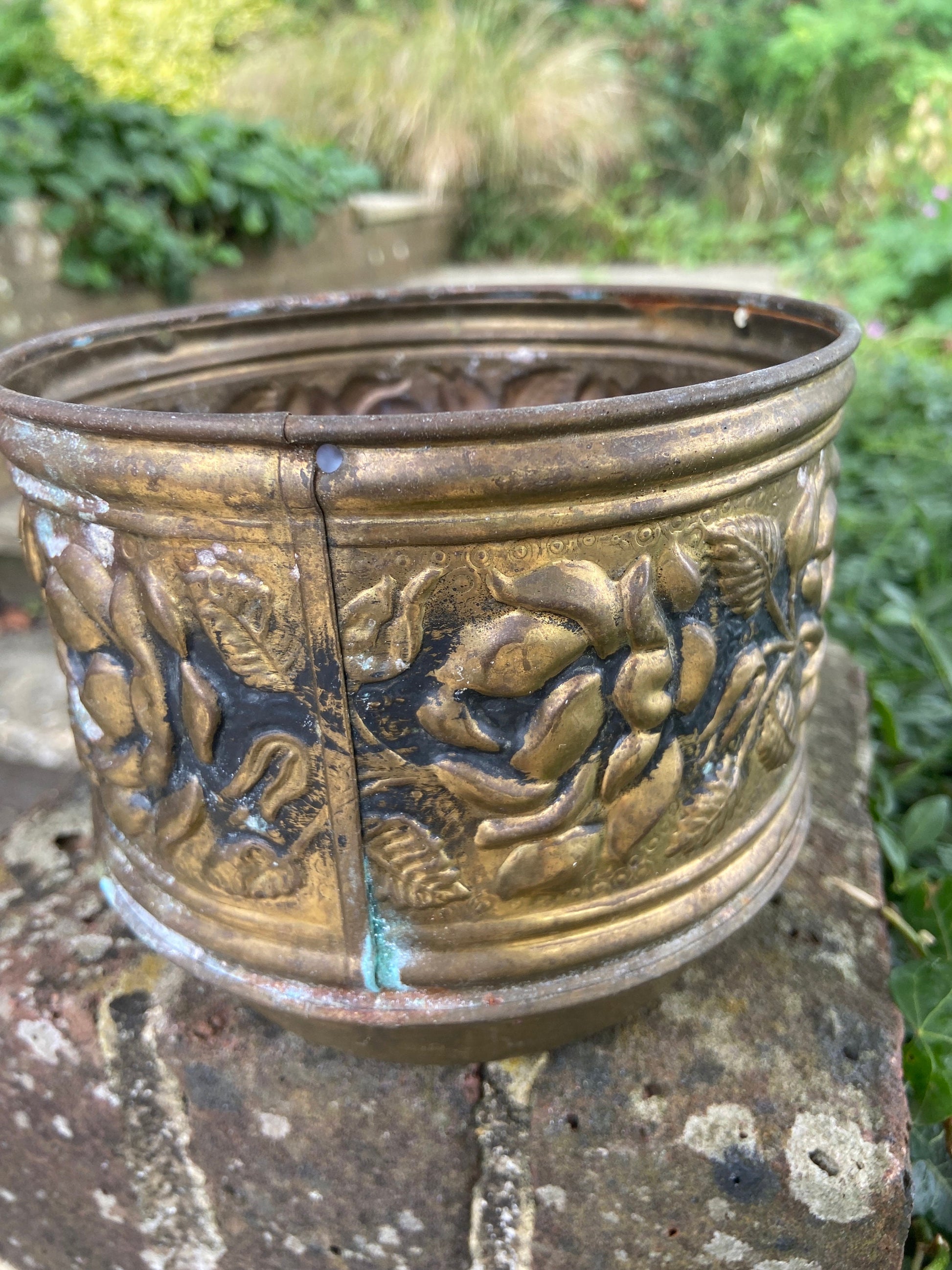 three brass planters, two simialr