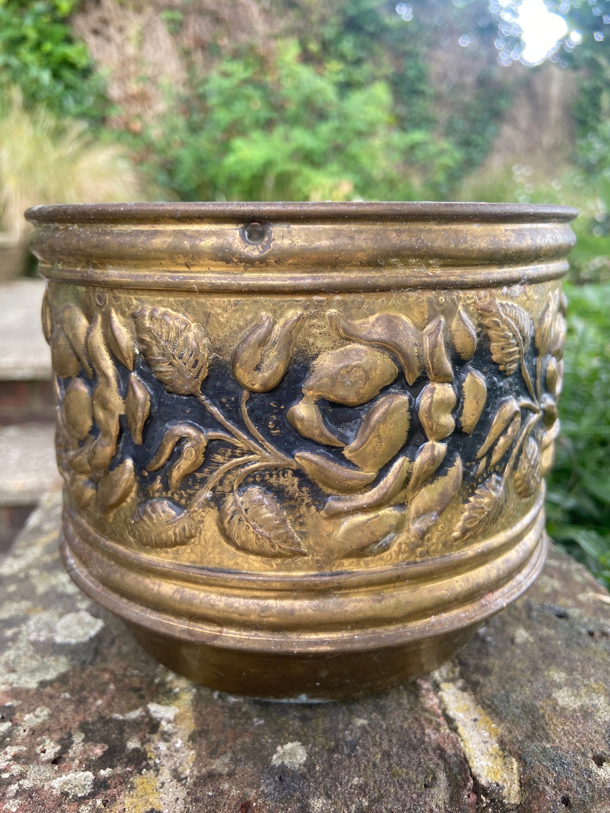three brass planters, two simialr