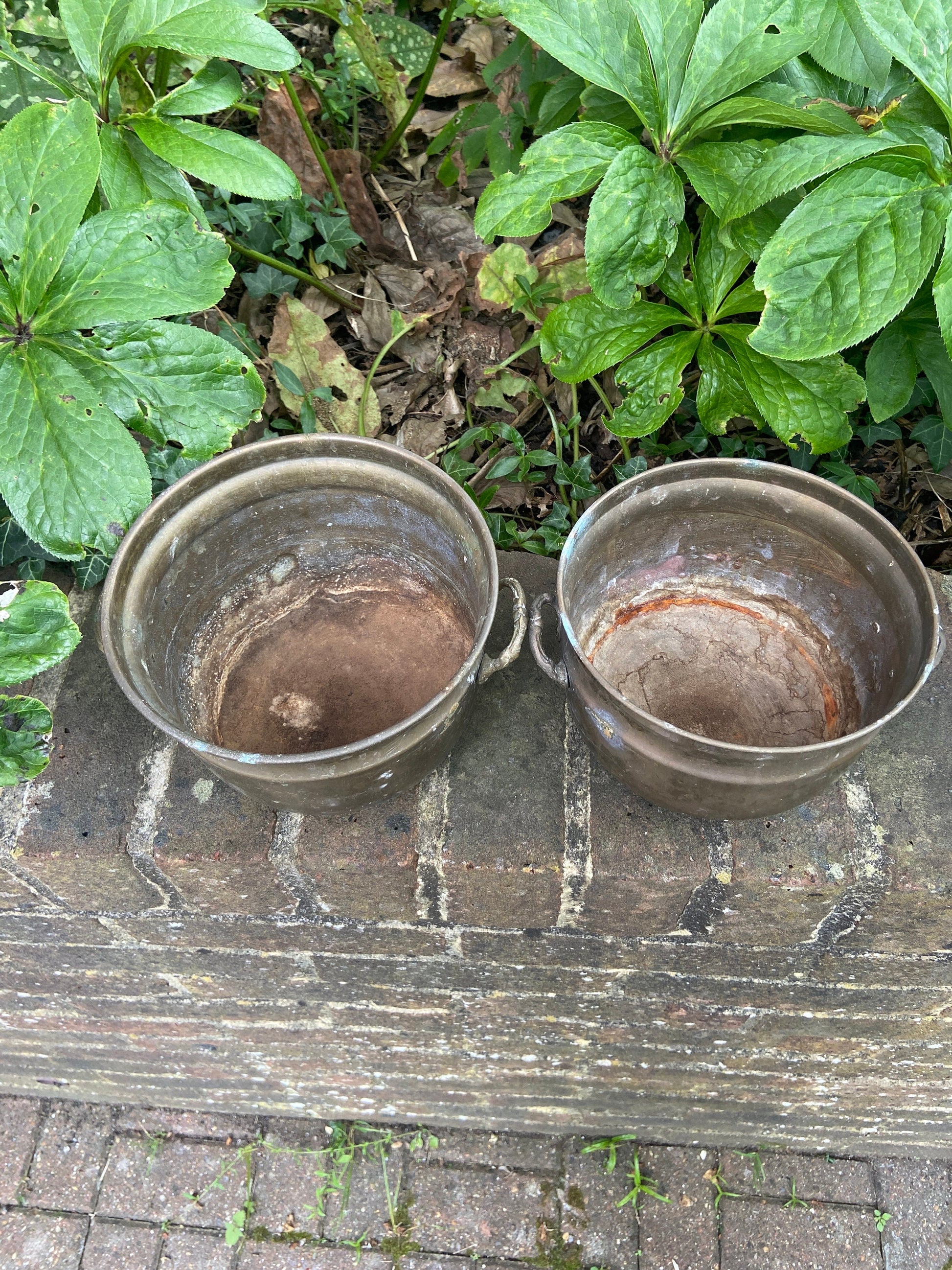 three brass planters, two simialr
