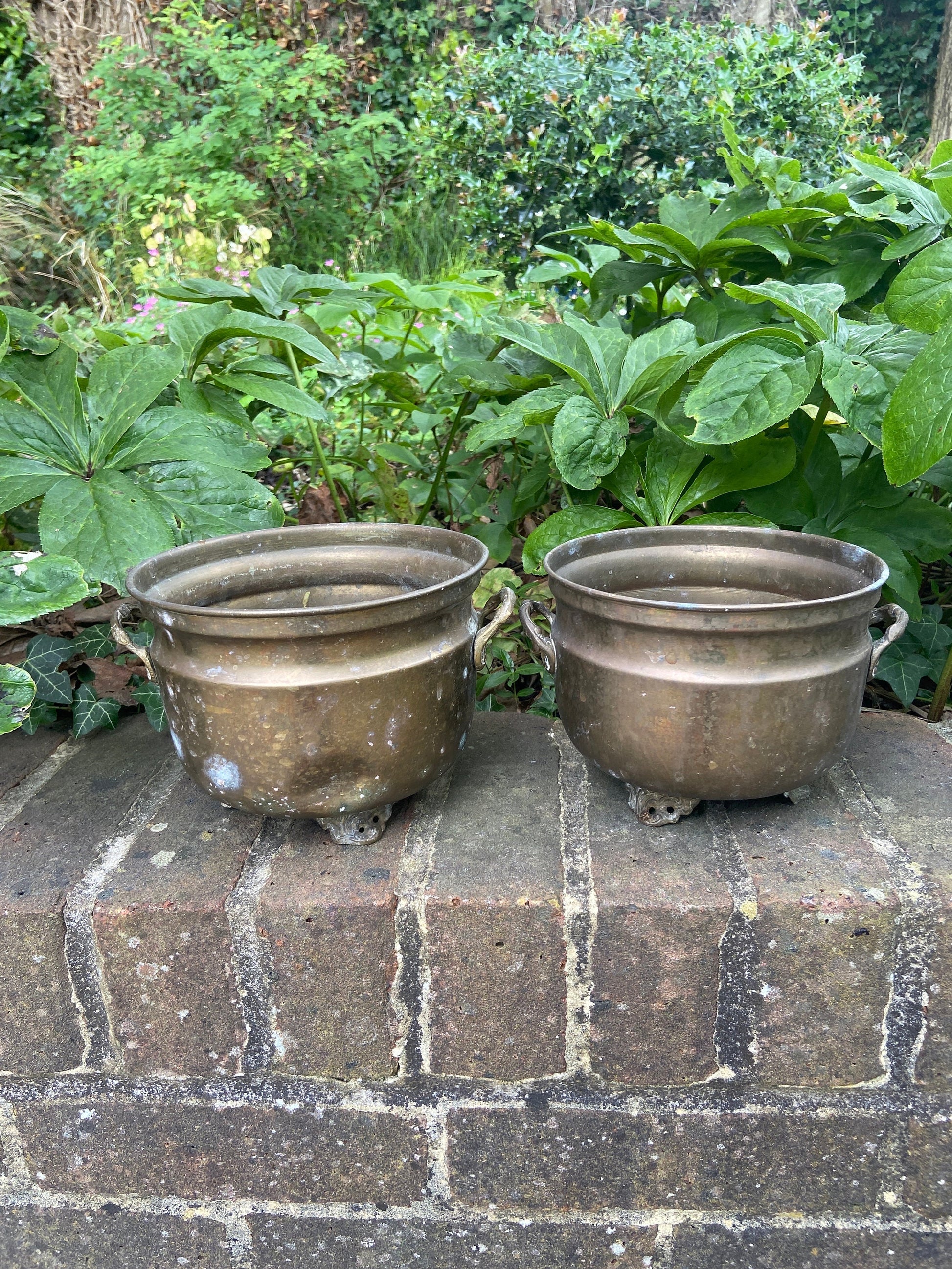 three brass planters, two simialr