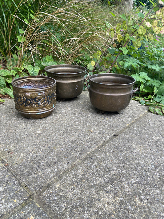 three brass planters, two simialr