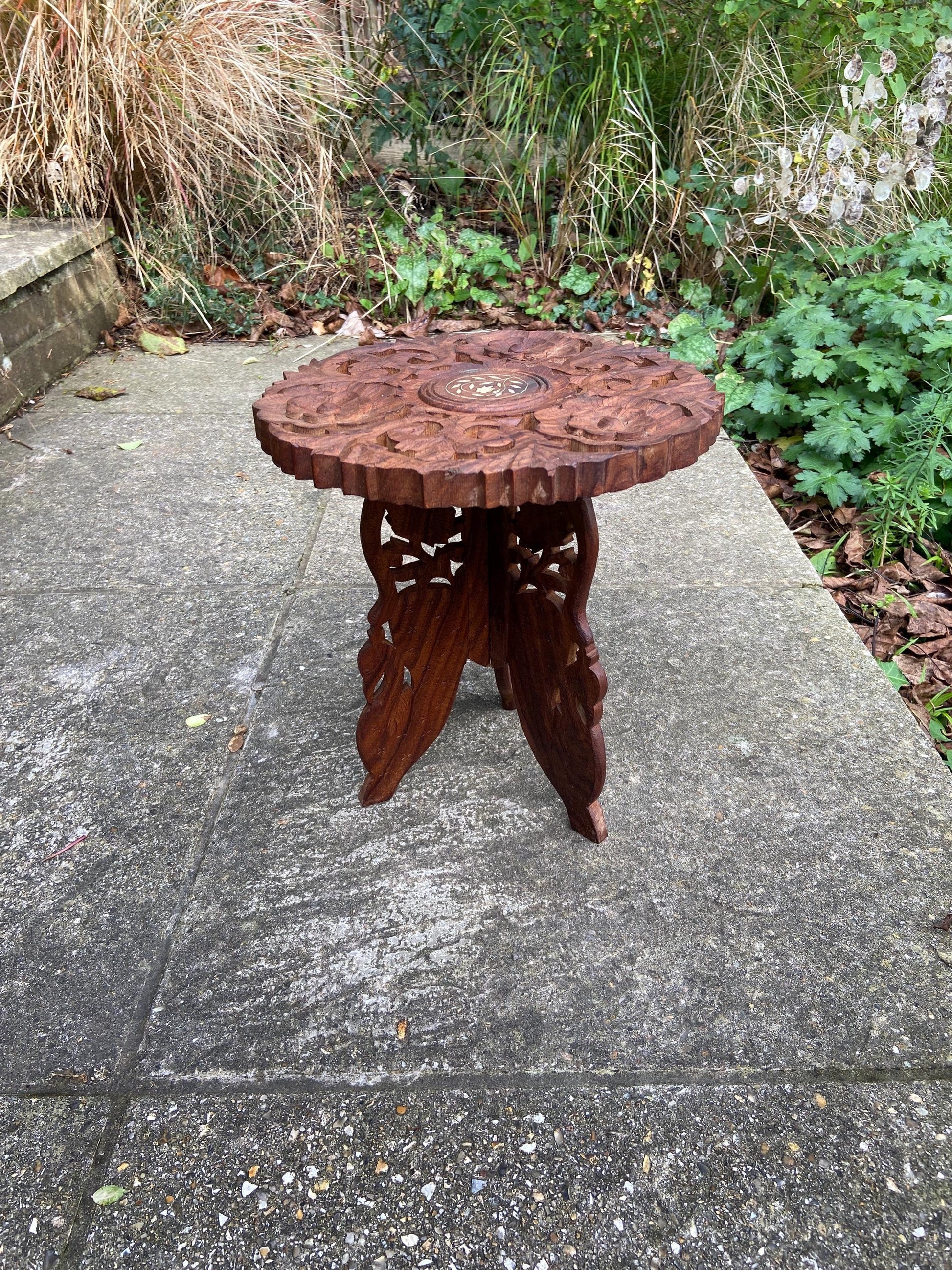 small carved table. folding table. Asian table. end table. coffee table. wooden plant stand wood table