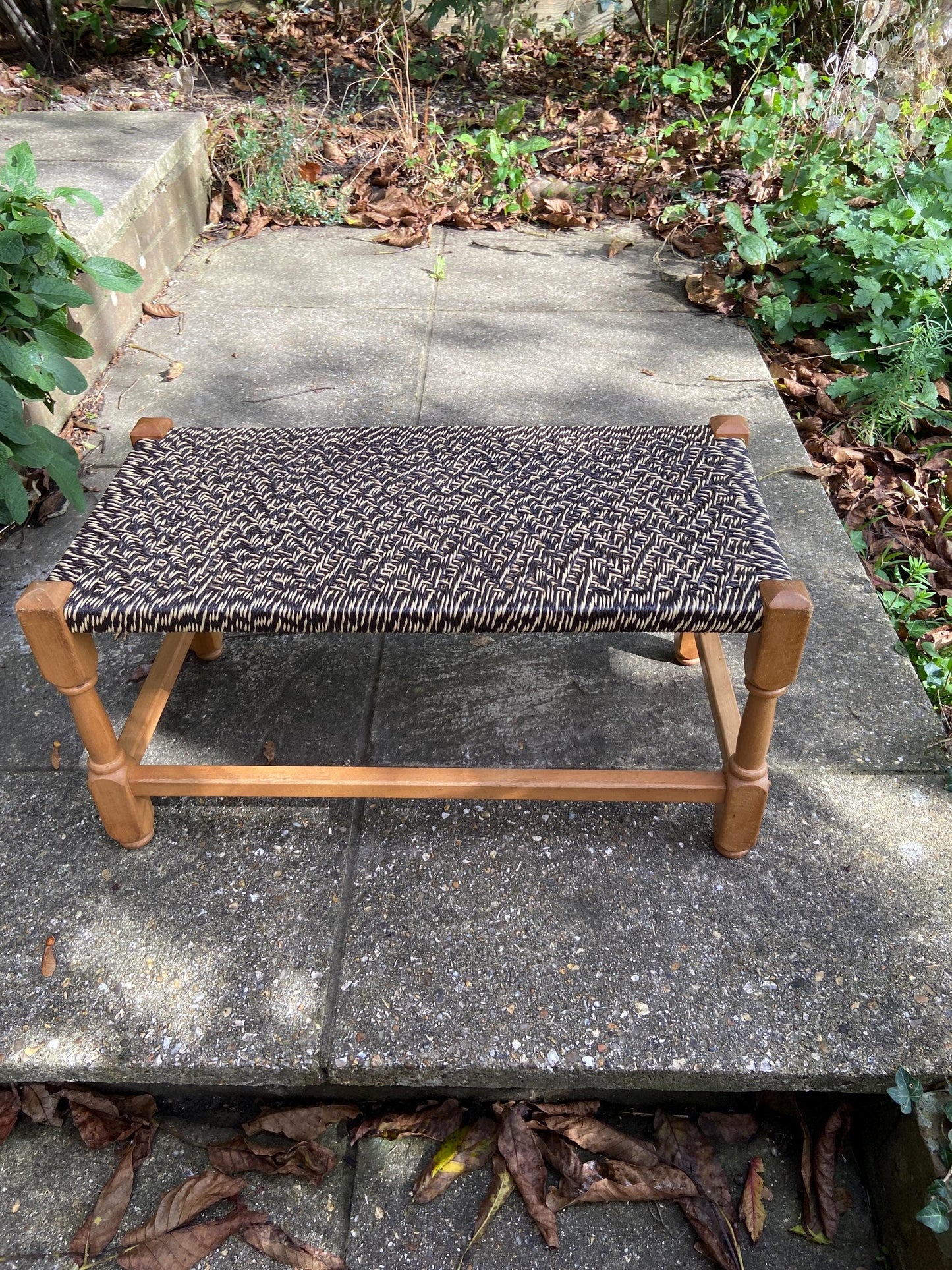 Retro strung string stool – excellent condition, black and white plastic string criss-cross on light coloured wooden frame